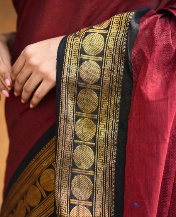 Maroon Plain Chettinad Cotton Saree, Complemented by a Contrast Rudraksham Design Traditional Zari Border, Subtly Striped Pallu, and Paired with a Matching Blouse