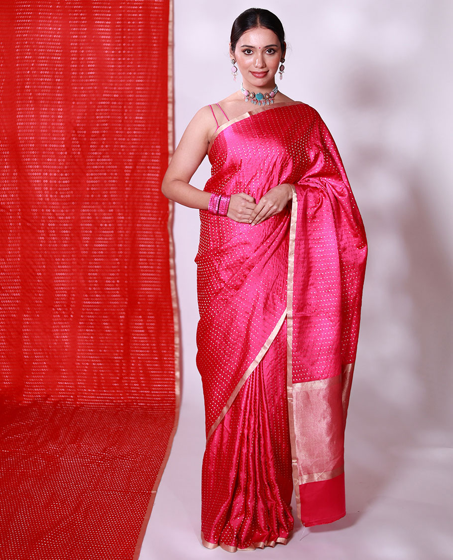 Bright pink dobbly style dotted banarasi silk saree, piping zari border, and chevron striped pallu