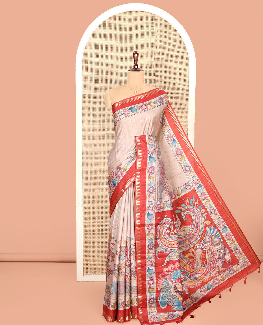 Chikku-Red Fancy Tussar Saree, Artfully Detailed with Kalamkari-Style Floral Print Across Its Body, Complemented by Contrast Temple Zari Border, a Colourfully Kalamkari Printed Pallu, and Paired with a Plain Blouse