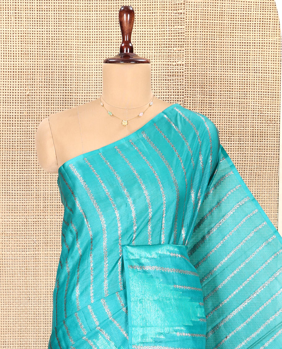 Borderless Green Tussar Silk Saree, Adorned With Zari Stripes All Over Its Body, Highlighted by Self-Pallu and Paired with a Matching Blouse