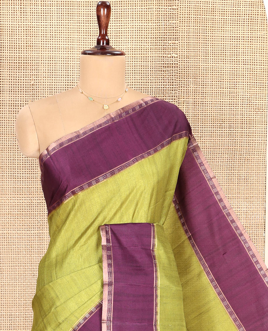 Olive Green Plain Semi-Tussar Silk Saree, Complemented by a Contrast Geometric Design Border, Subtly Zari Striped Pallu, and Paired with a Contrast Patola Printed Blouse