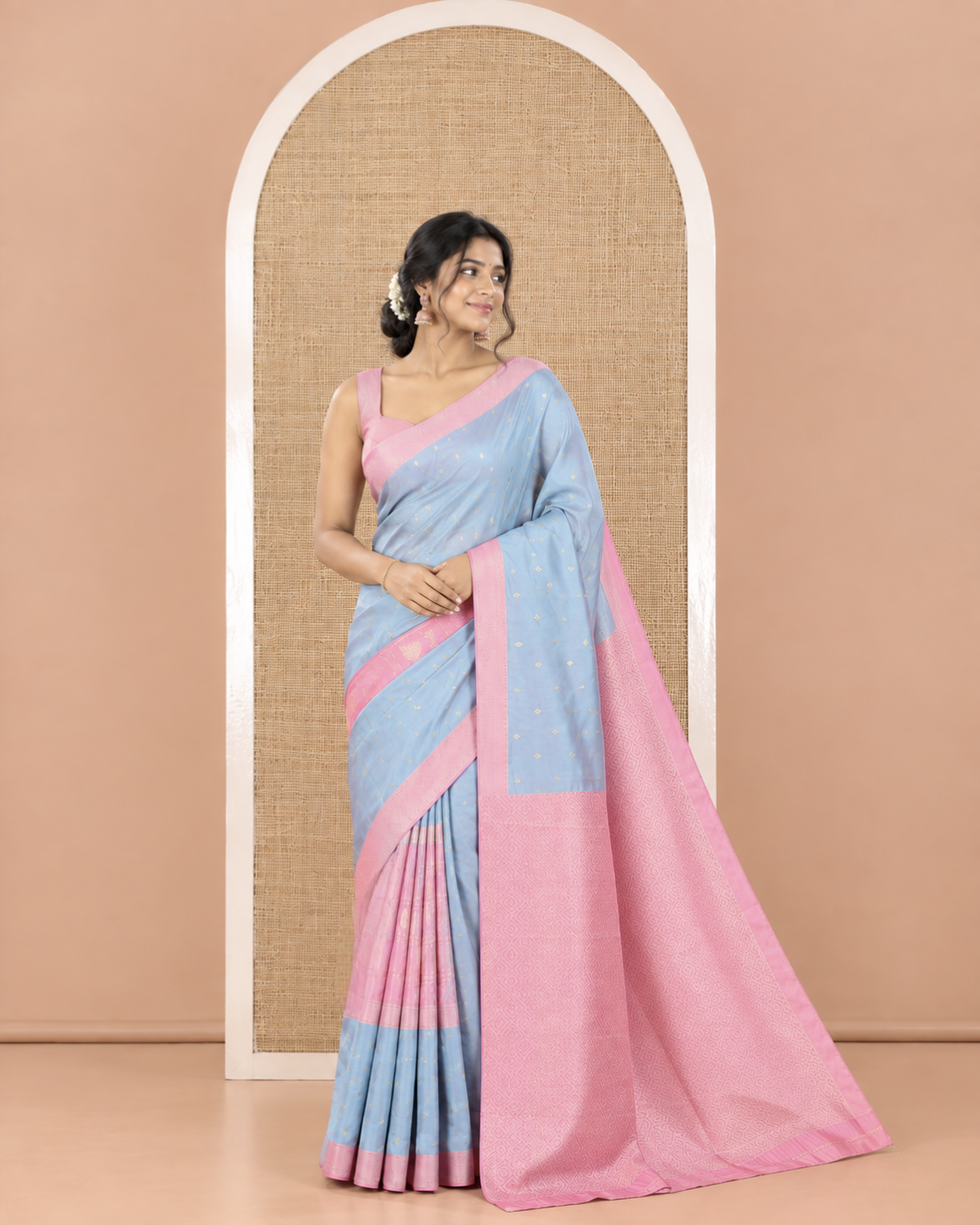 Grey and Pink Kanchi Silk Saree, Subtly Enriched with Zari Buttas and Buttas Enclosed Checks On Its Body, Complemented by Zari Border, Jaal Pallu, and Paired with a Contrast Jacquard Blouse