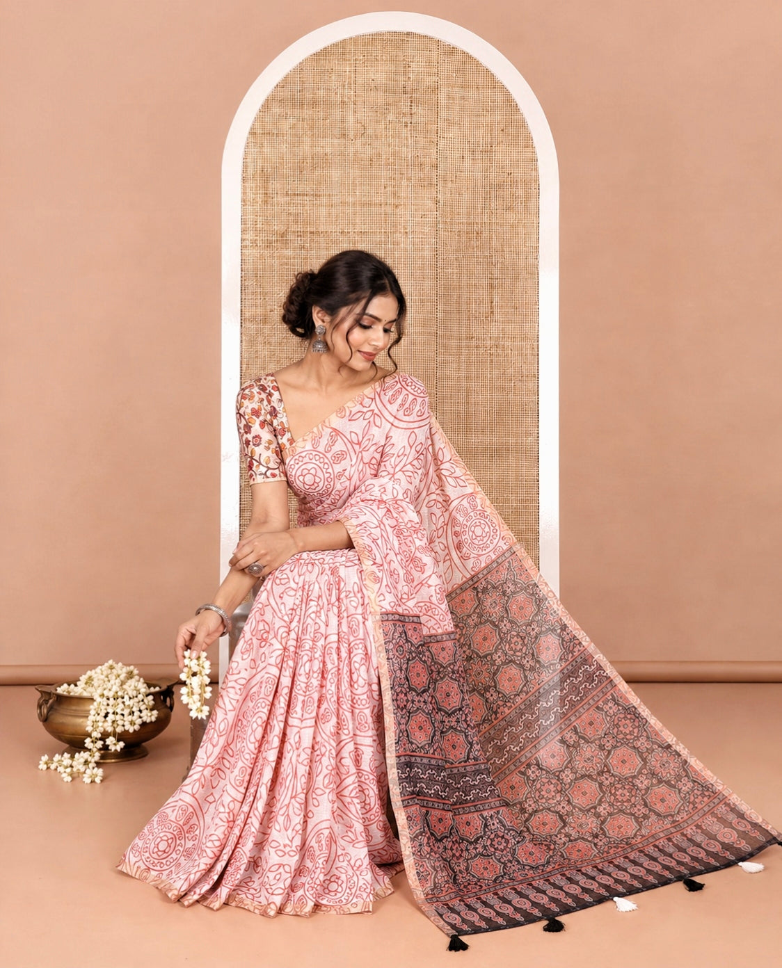 white bandhani-style floral and chakra printed saree, zari piping border, contrast ajrakh printed pallu, and contrast ajrakh printed blouse