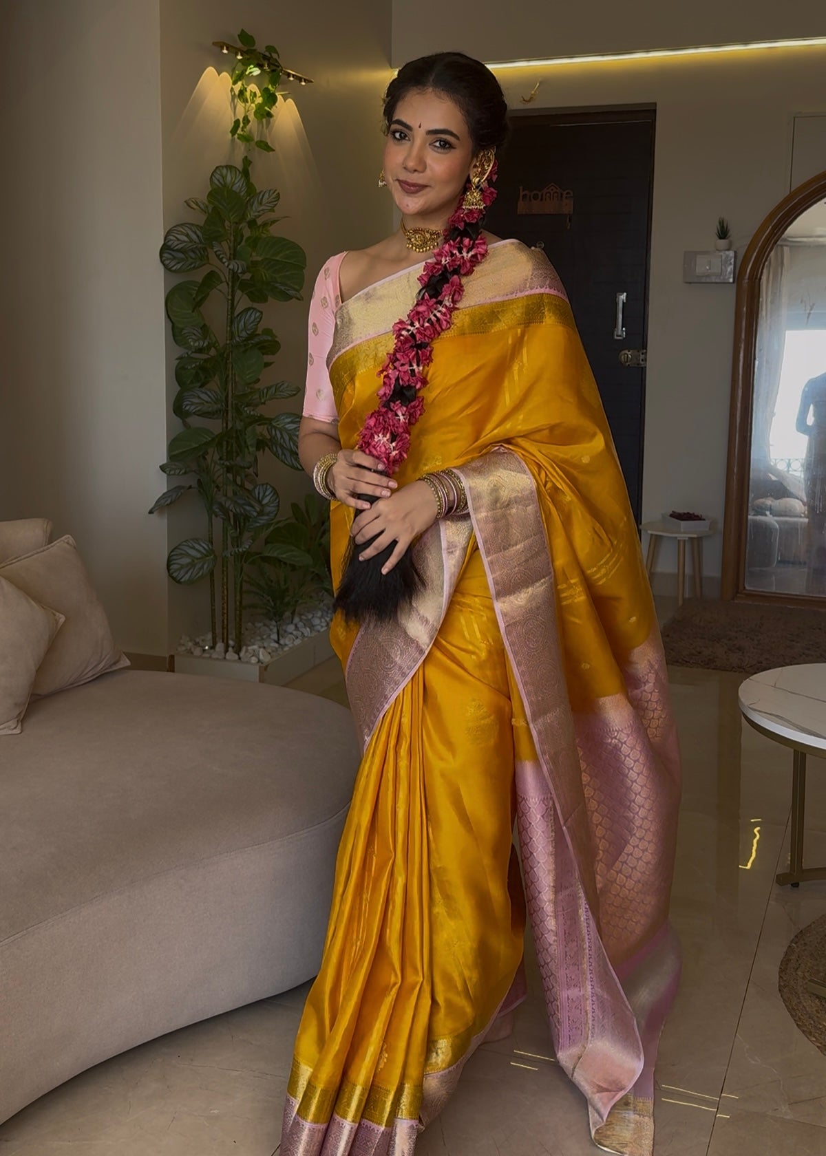Mustard Yellow-Beach Pink Vasundhara Silk Saree Features Zari Buttas, Contrast Border of Cross Kamalam, Rudraksham, and Thilakam, Grand Pallu, and a Contrast Blouse