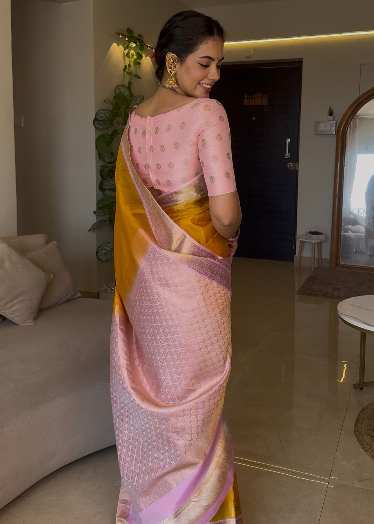 Mustard Yellow-Beach Pink Vasundhara Silk Saree Features Zari Buttas, Contrast Border of Cross Kamalam, Rudraksham, and Thilakam, Grand Pallu, and a Contrast Blouse