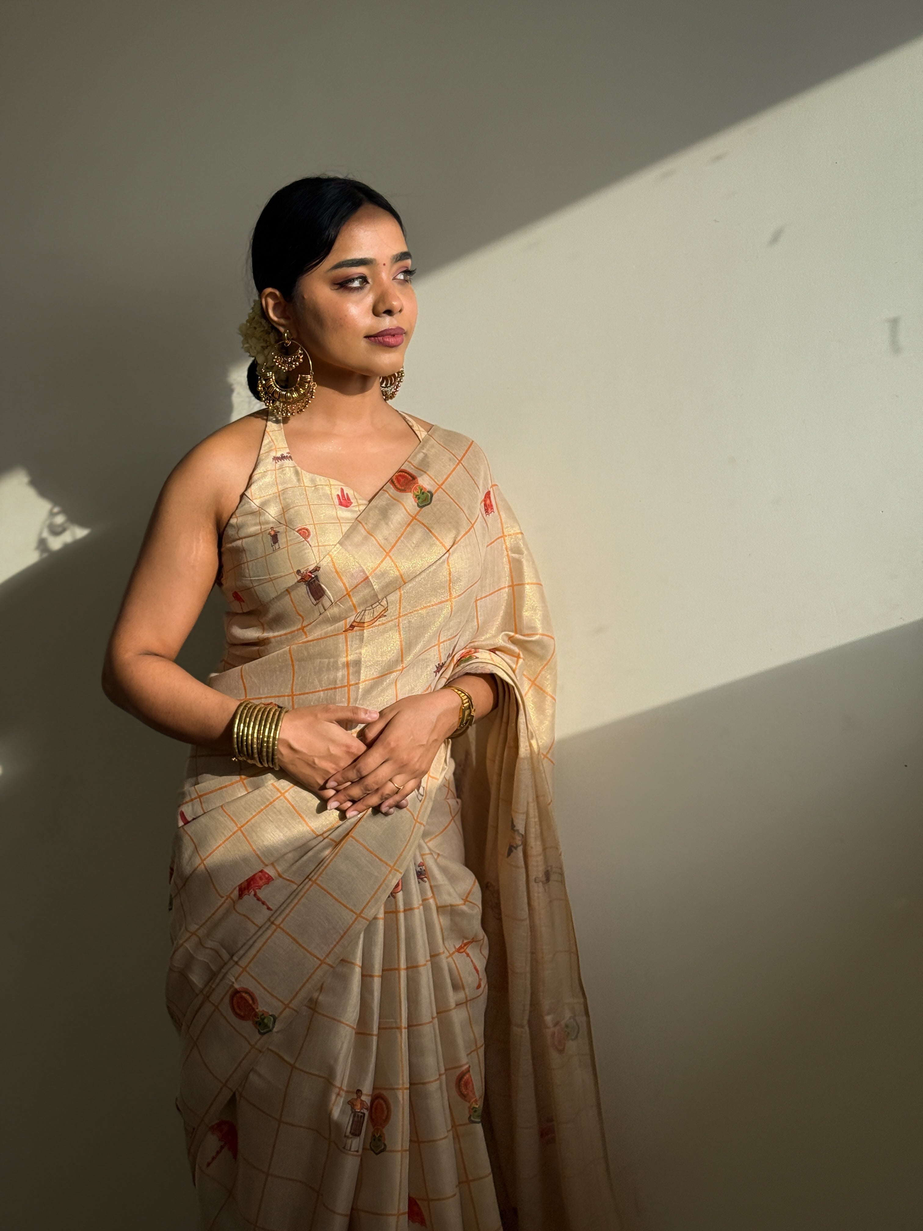 Borderless Gold Tissue Saree with a Kerala-Themed Motif of Enclosed Checks and a Matching Blouse