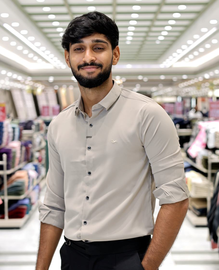 Cream Solid Poly-Blended Formal Shirt Features Full Sleeves, a Slim Fit, a Spread Collar, and Regular Length
