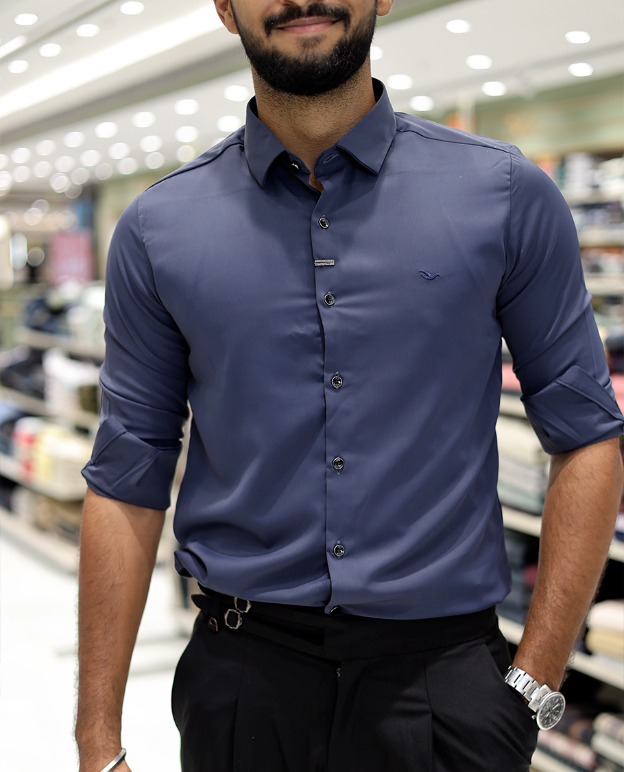 Blue Solid Poly-Blended Formal Shirt Features Full Sleeves, a Slim Fit, a Spread Collar, and Regular Length