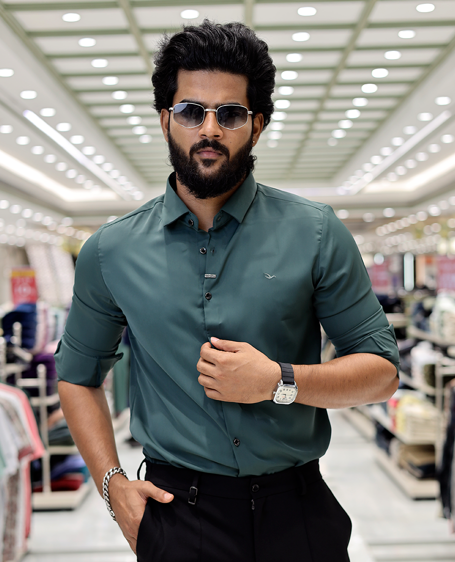Green Solid Poly-Blended Formal Shirt Features Full Sleeves, a Slim Fit, a Spread Collar, and Regular Length