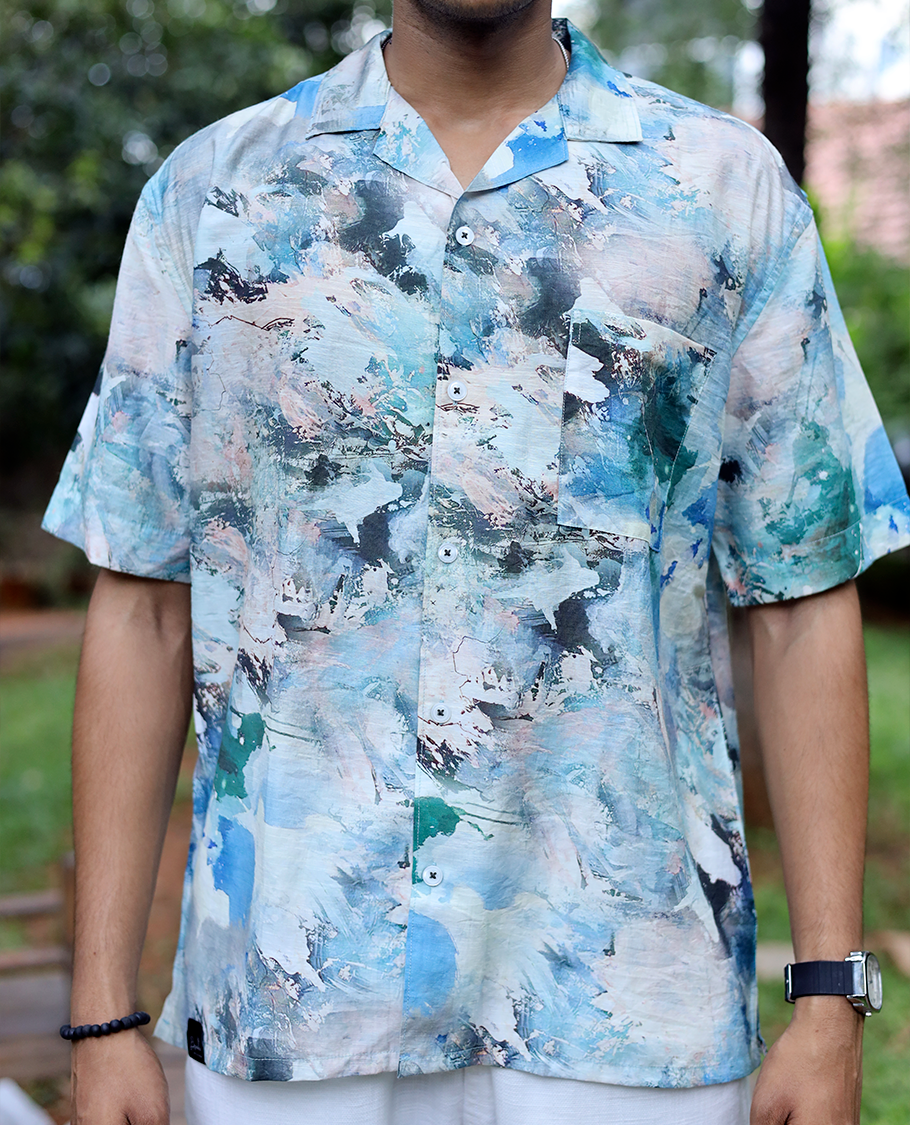 Blue Cotton-Blended Casual Shirt Elevated with Abstract-Painting-Style Print, Half Sleeves, a Regular Fit, a Cuban Collar, and a Regular Length