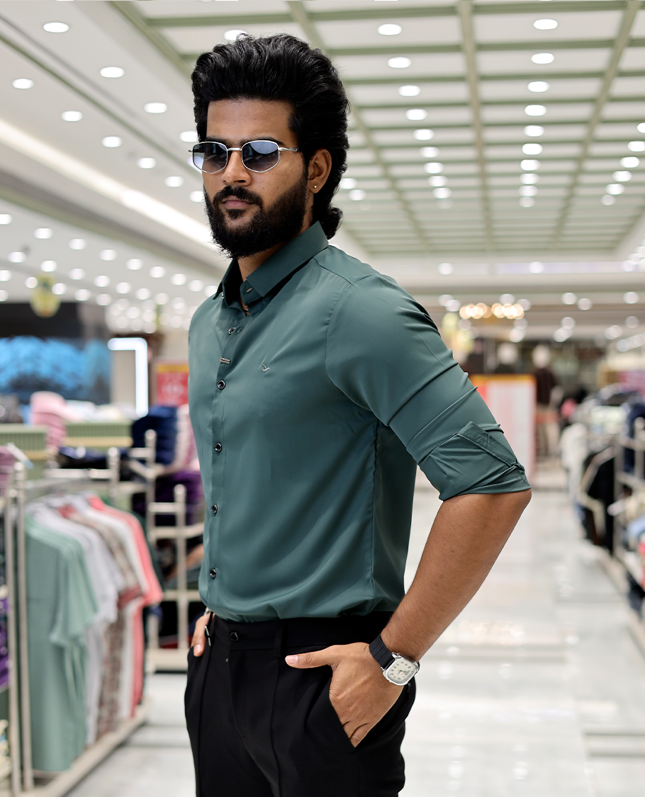 Green Solid Poly-Blended Formal Shirt Features Full Sleeves, a Slim Fit, a Spread Collar, and Regular Length