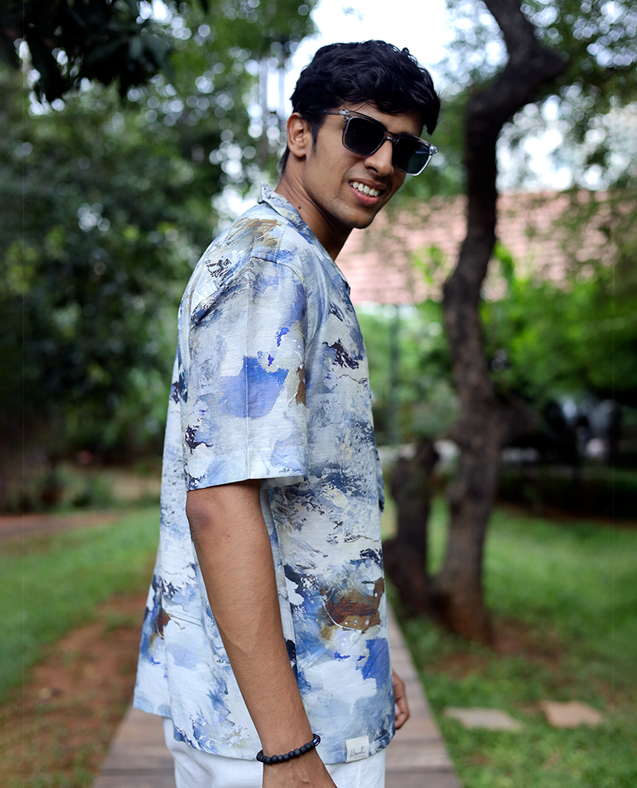Blue Cotton-Blended Casual Shirt Beautified with Abstract-Painting-Style Print, Half Sleeves, a Regular Fit, a Cuban Collar, and a Regular Length