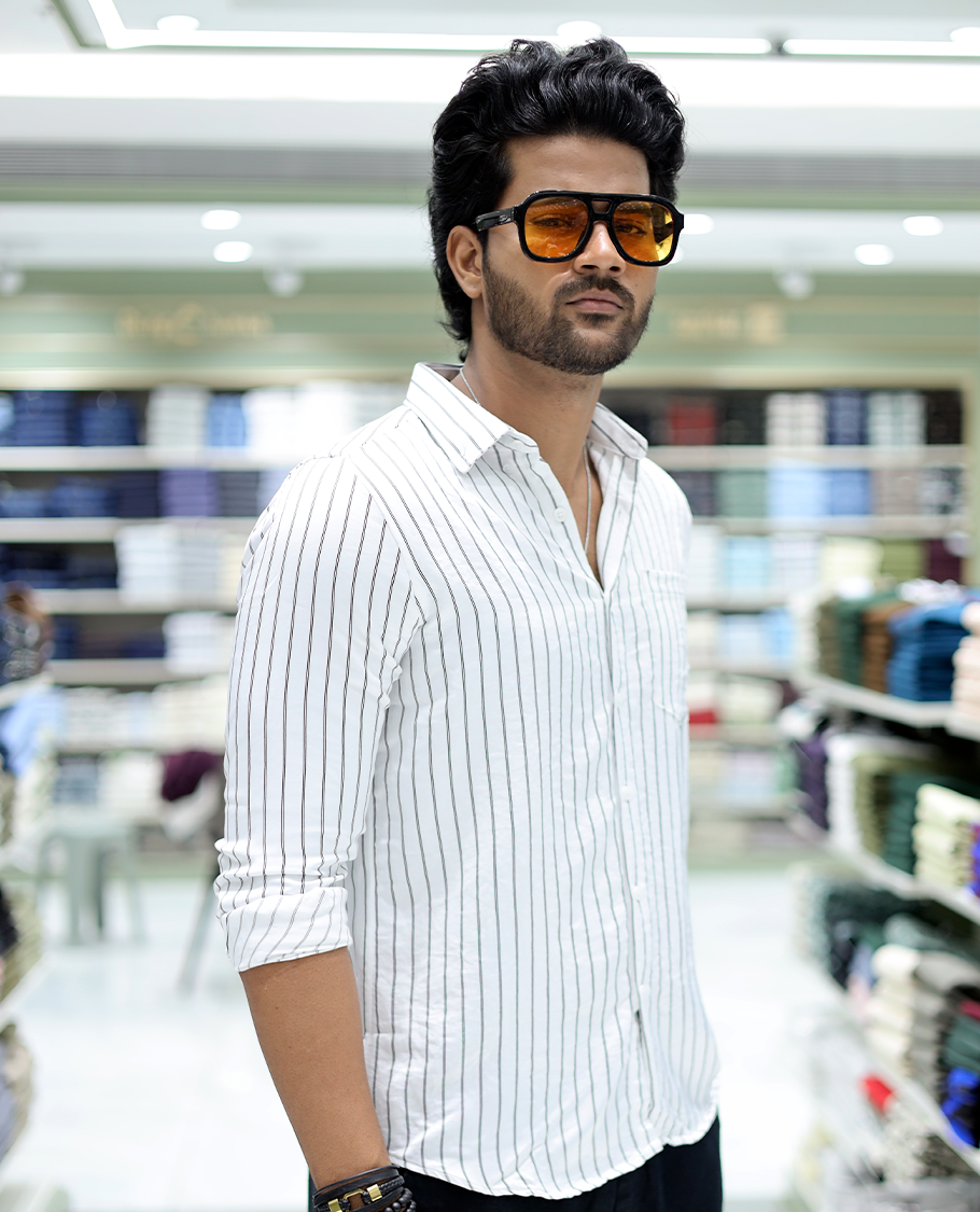 White Striped Poly-Blended Formal Shirt Comes with Full Sleeves, a Spread Collar, a Slim Fit, and a Regular Length