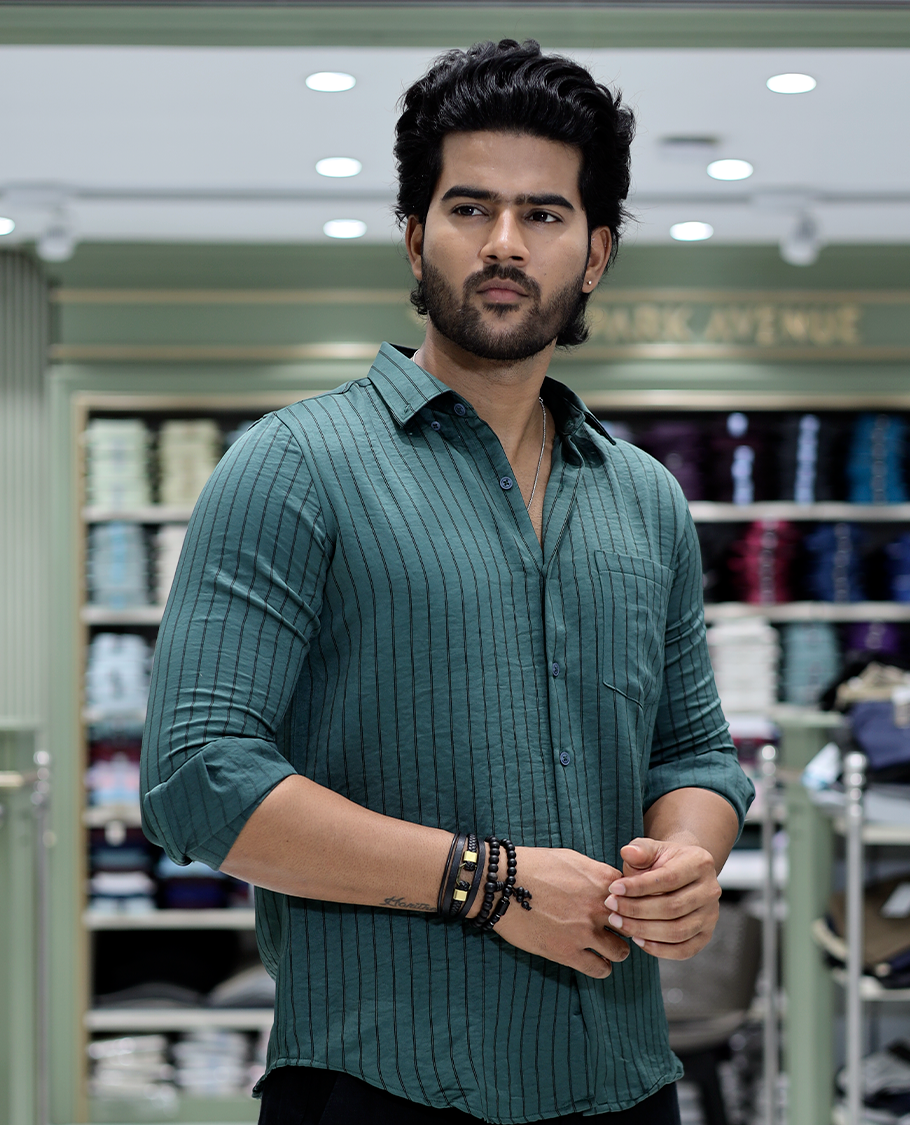Green Striped Poly-Blended Formal Shirt Comes with Full Sleeves, a Spread Collar, a Slim Fit, and a Regular Length