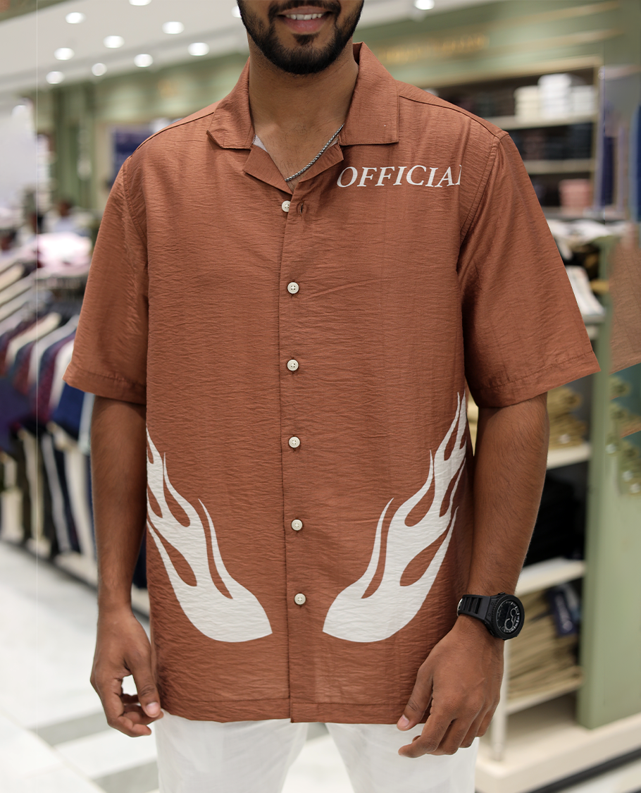 Brown Poly-Blended Causal Shirt, Comes with Fire Motifs Print, Half Sleeves, a Cuban Collar, a Boxy Fit, and Regular Length