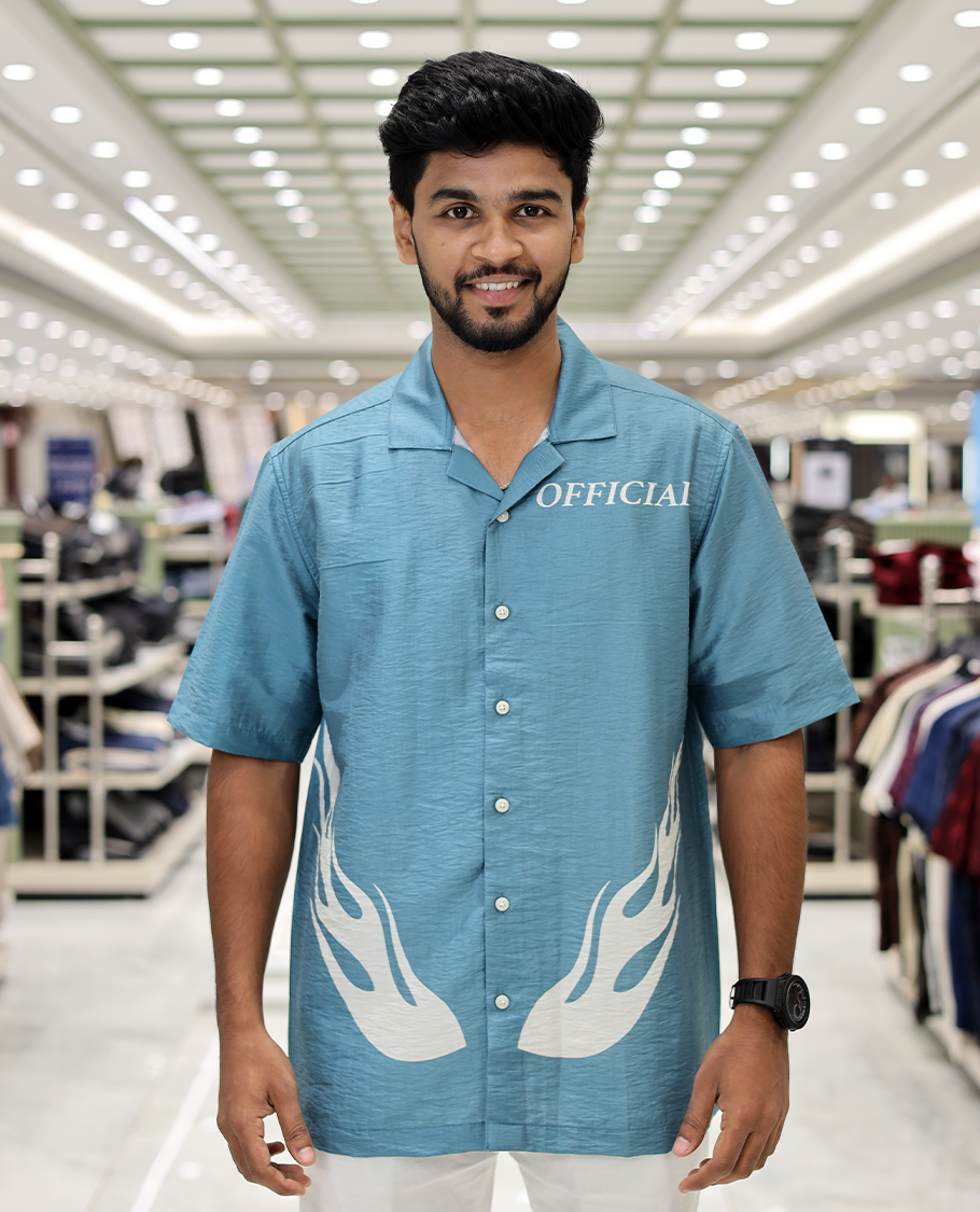 Blue Poly-Blended Causal Shirt, Comes with Fire Motifs Print, Half Sleeves, a Cuban Collar, a Boxy Fit, and Regular Length