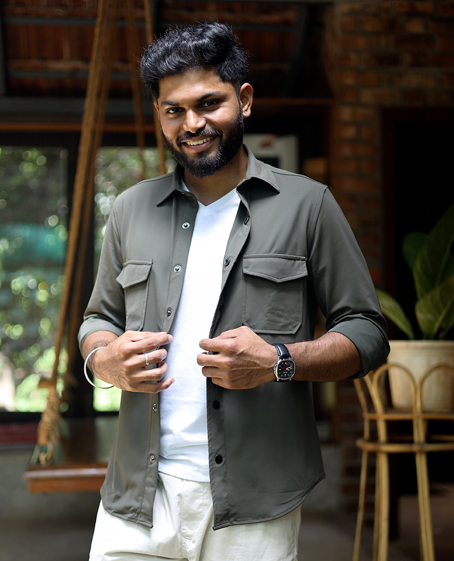 Green Solid Poly-Blended Casual Shirt Featuring Full Sleeves, a Spread Collar, a Slim Fit, and Regular Length