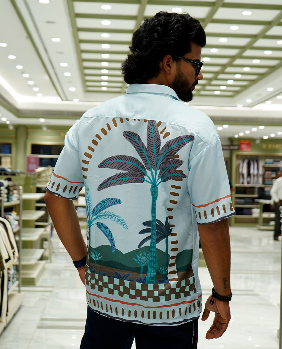 Light Blue Cotton-Blended Casual Shirt Features Tropical Flora Print, Full Sleeves, a Spread Collar, a Slim Fit, and a Regular Length