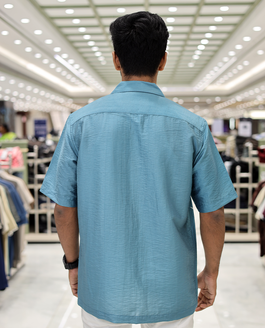 Blue Poly-Blended Causal Shirt, Comes with Fire Motifs Print, Half Sleeves, a Cuban Collar, a Boxy Fit, and Regular Length