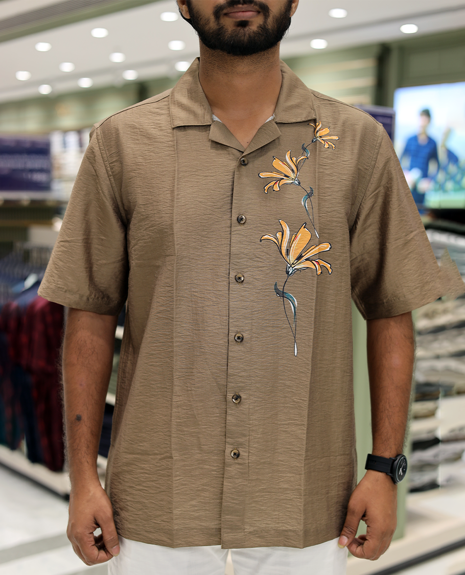 Brown Poly-Blended Causal Shirt, Comes with Floral Print, Half Sleeves, a Cuban Collar, a Boxy Fit, and Regular Length