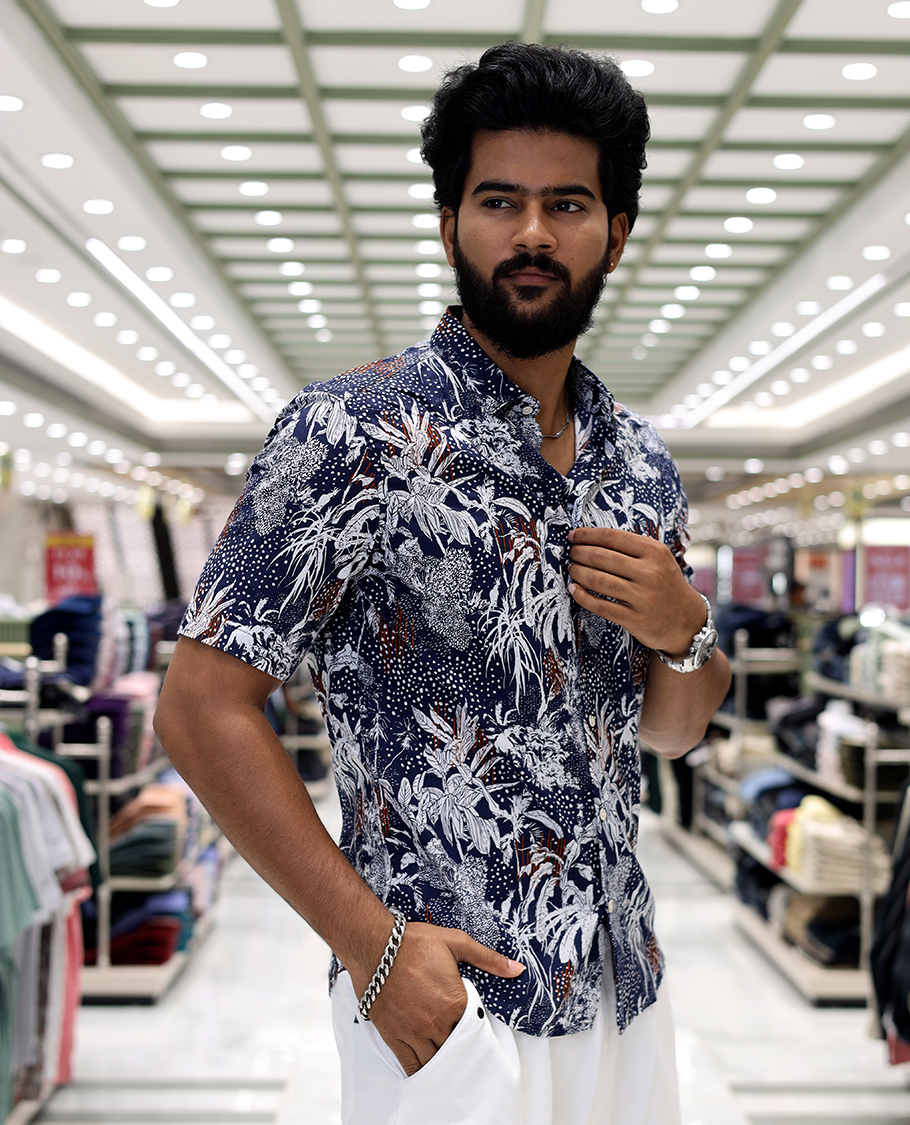 Blue Cotton-Blended Casual Shirt, Decked Up with Tropical Floral Print, Half Sleeves, a Regular Fit, a Spread Collar, and Regular Length