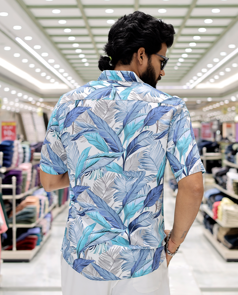 Blue Cotton-Blended Casual Shirt, Elevated with Tropical Floral Print, Half Sleeves, a Regular Fit, a Spread Collar, and Regular Length