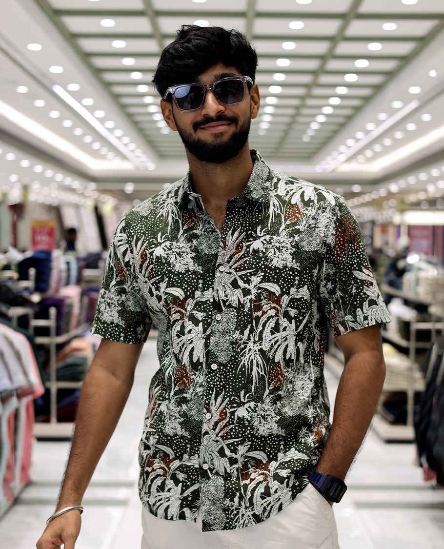 Green Cotton-Blended Casual Shirt, Accentuated with Tropical Floral Print, Half Sleeves, a Regular Fit, a Spread Collar, and Regular Length