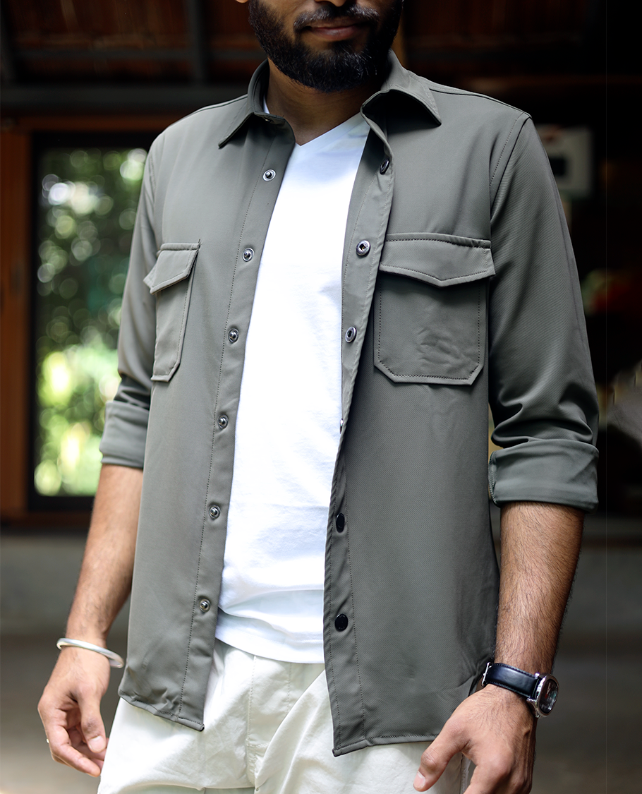 Green Solid Poly-Blended Casual Shirt Featuring Full Sleeves, a Spread Collar, a Slim Fit, and Regular Length