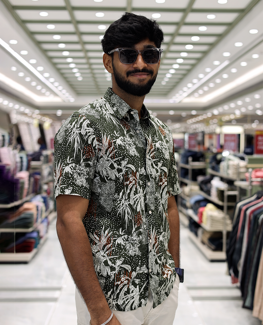 Green Cotton-Blended Casual Shirt, Accentuated with Tropical Floral Print, Half Sleeves, a Regular Fit, a Spread Collar, and Regular Length