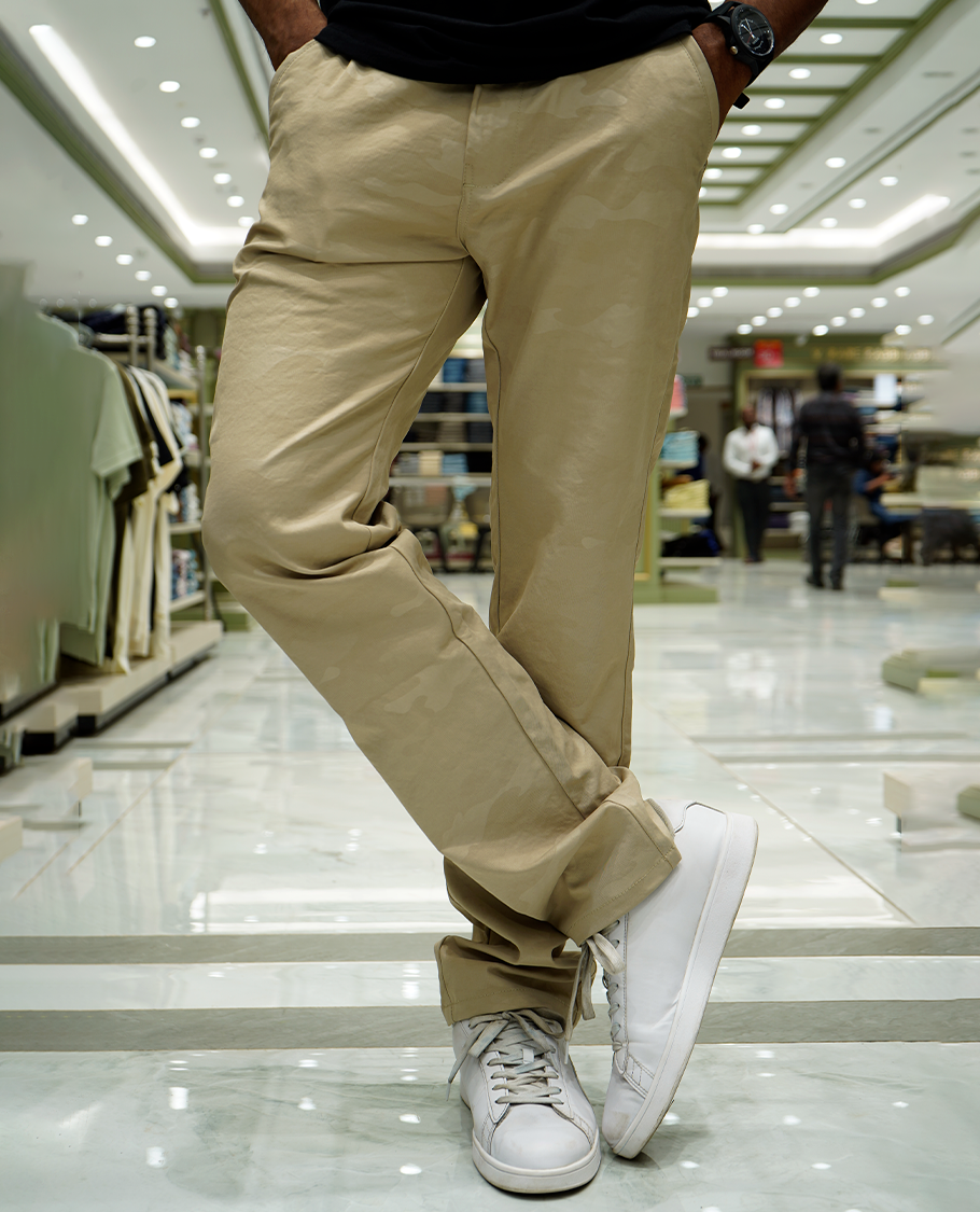 Cream Textured Lycra Traveller Trousers Comes with a Regular Fit and a Regular Length