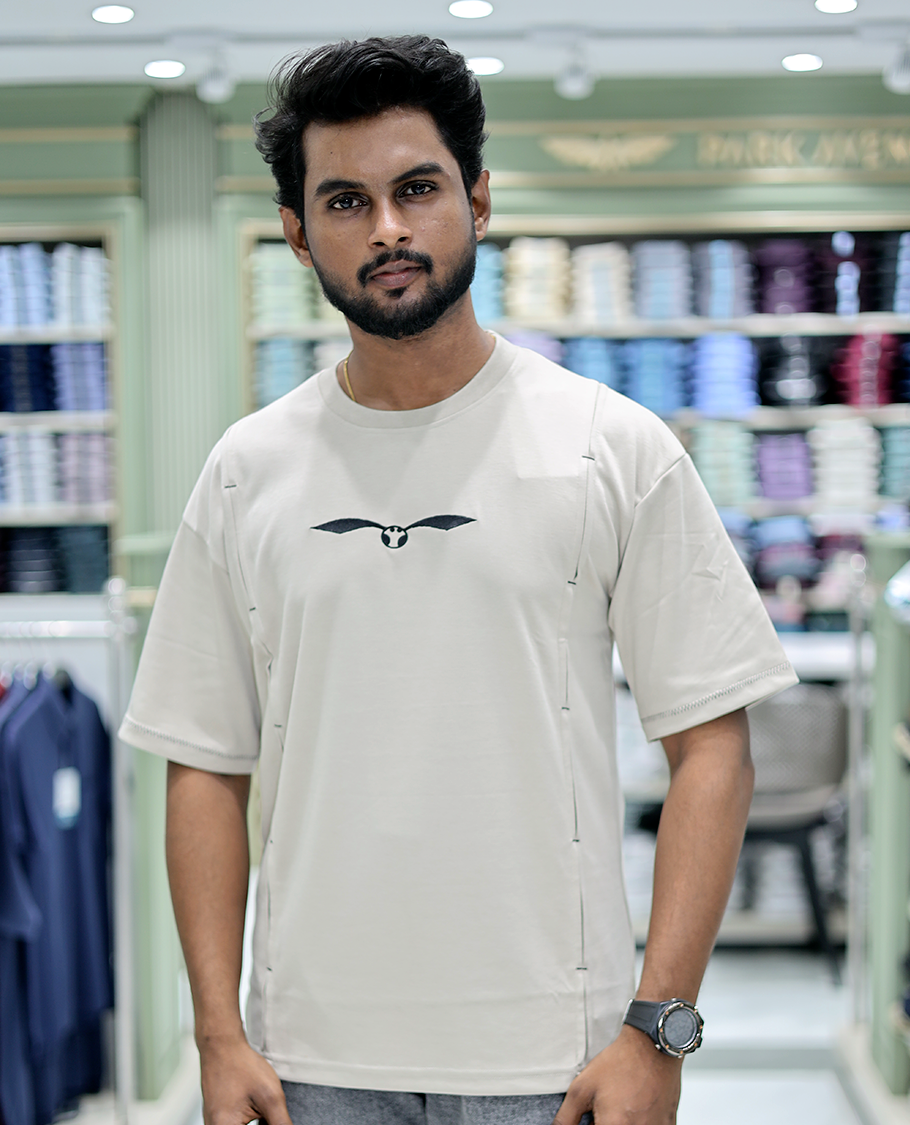 Cream Solid Cotton-Blended T-Shirt Features Half Sleeves, a Crew Neck, a Regular Fit, and a Regular Length