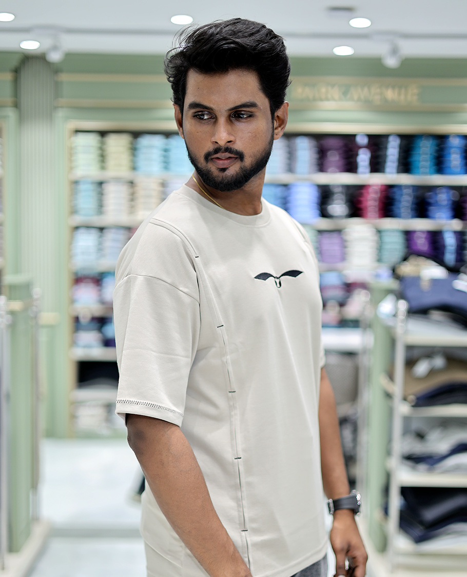 Cream Solid Cotton-Blended T-Shirt Features Half Sleeves, a Crew Neck, a Regular Fit, and a Regular Length