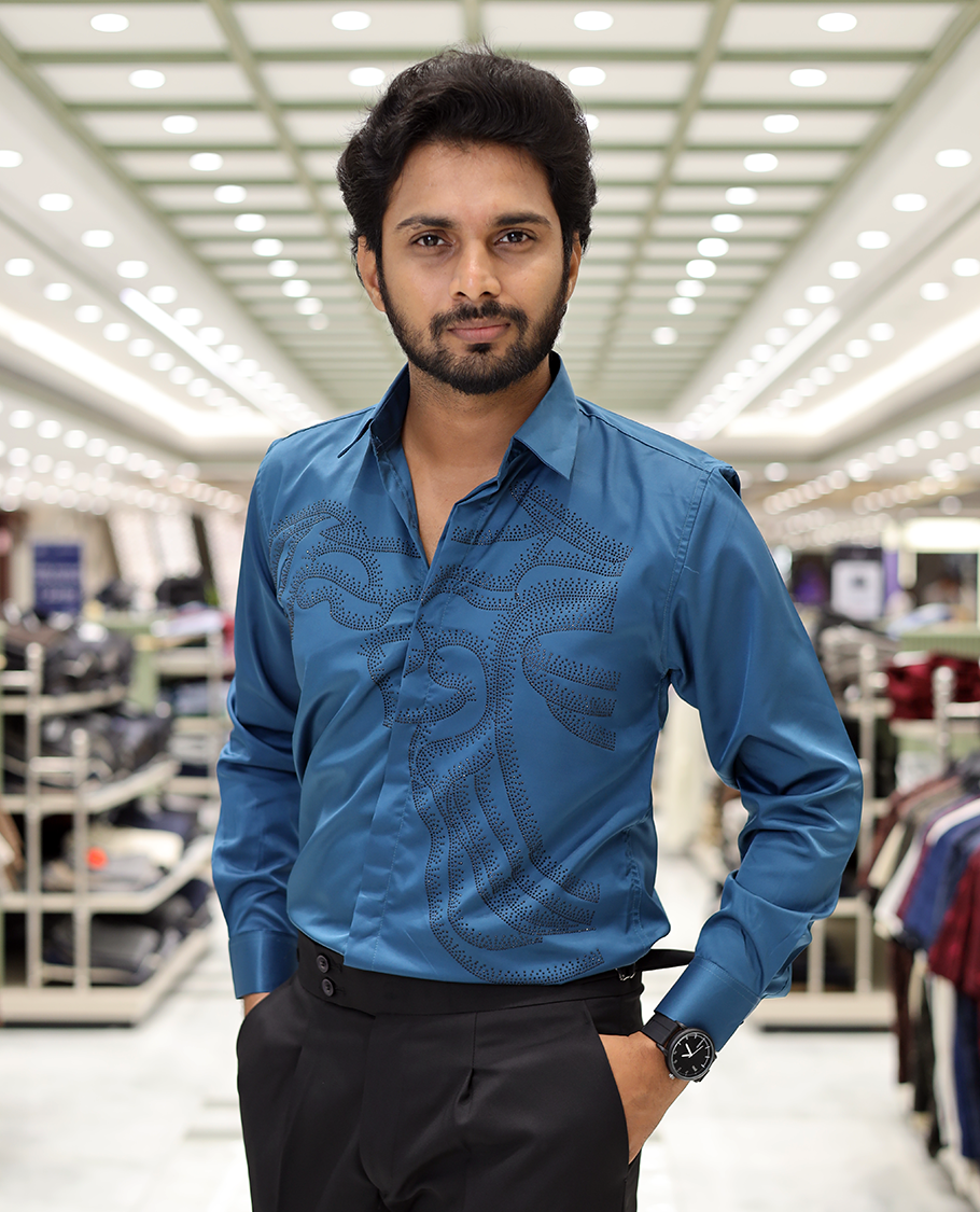 Peacock Blue Poly-Blended Party Wear Shirt, Features Vines-Themed Stone Work, Full Sleeves, a Spread Collar, Slim Fit, and Regular Length