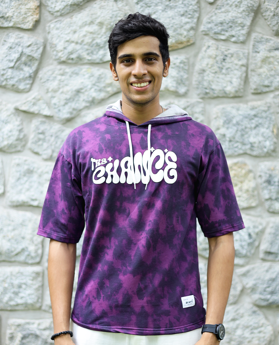 Purple Cotton-Blended Oversized Hooded T-Shirt Features Abstract Dyed Typography Print, Half-Sleeves, and Regular Length