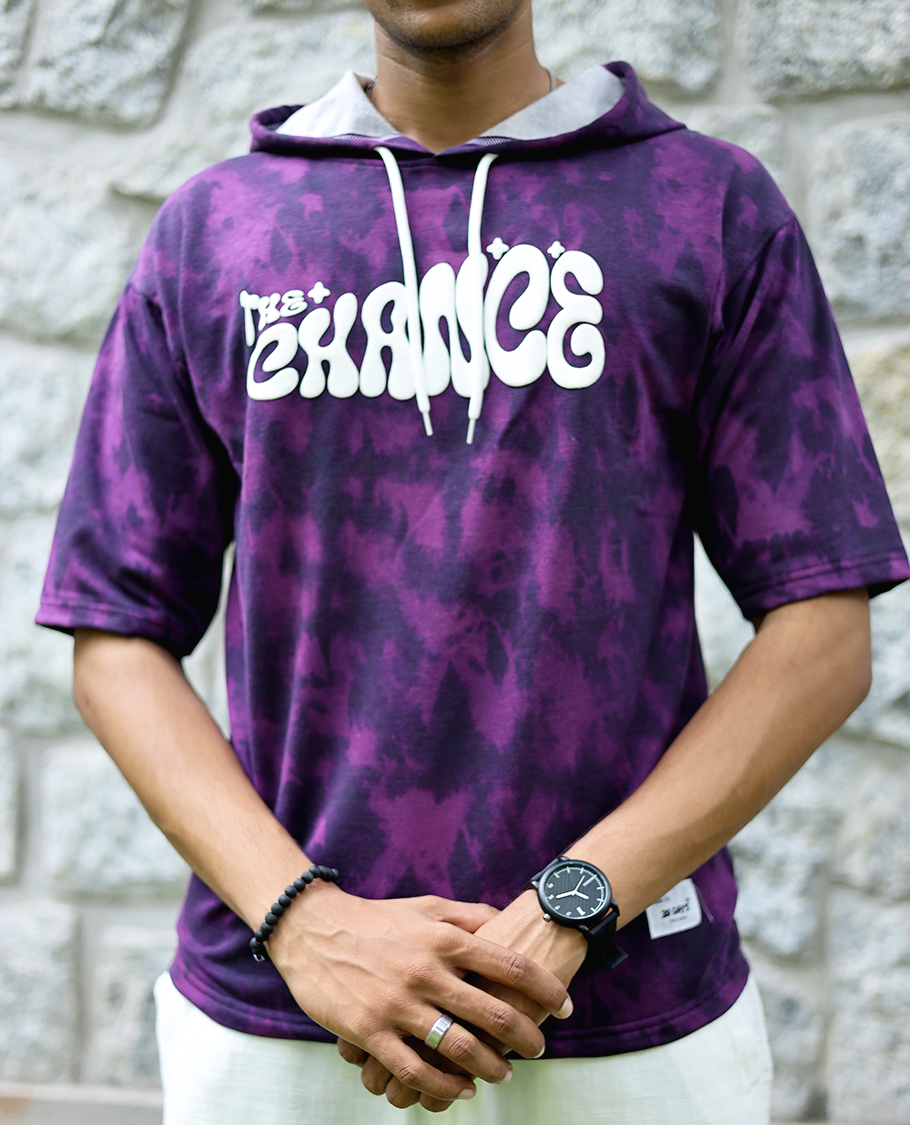 Purple Cotton-Blended Oversized Hooded T-Shirt Features Abstract Dyed Typography Print, Half-Sleeves, and Regular Length