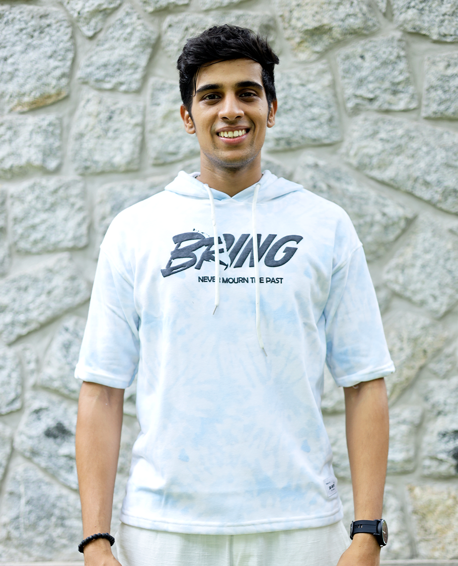 Light Blue Cotton-Blended Oversized Hooded T-Shirt Features Abstract Dyed Typography Print, Half-Sleeves, and Regular Length