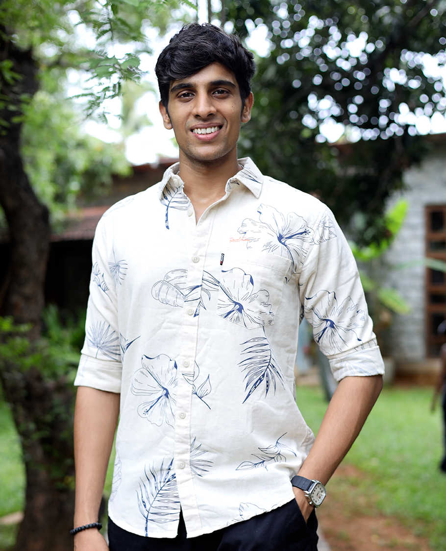 Cream Cotton-Blended Casual Shirt, Enthralled with Tropical Flora-themed Print, Full Sleeves, a Slim Fit, a Spread Collar, and a Regular Length