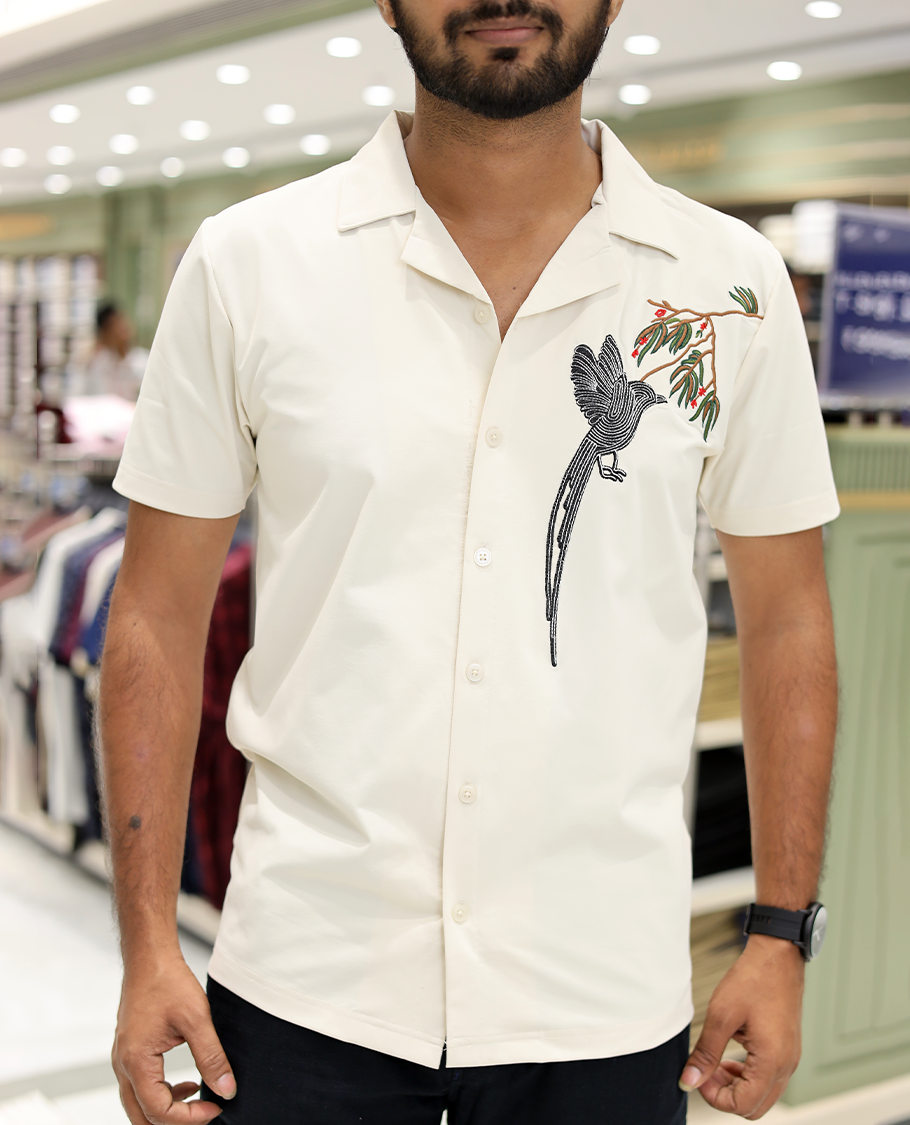Cream Cotton-Blended Casual Shirt Comes with Humming Bird Motifs, Knitted Embroidery, Cuban Collar, Half Sleeves, Boxy Fit, and Regular Length