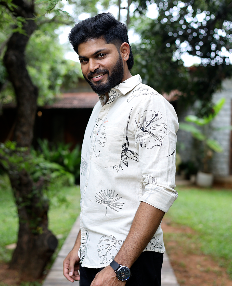 Cream Cotton-Blended Casual Shirt, Elevated with Tropical Flora-themed Print, Full Sleeves, a Slim Fit, a Spread Collar, and a Regular Length