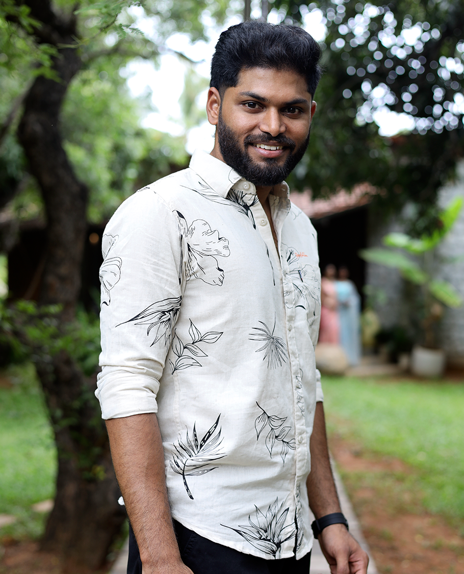 Cream Cotton-Blended Casual Shirt, Elevated with Tropical Flora-themed Print, Full Sleeves, a Slim Fit, a Spread Collar, and a Regular Length