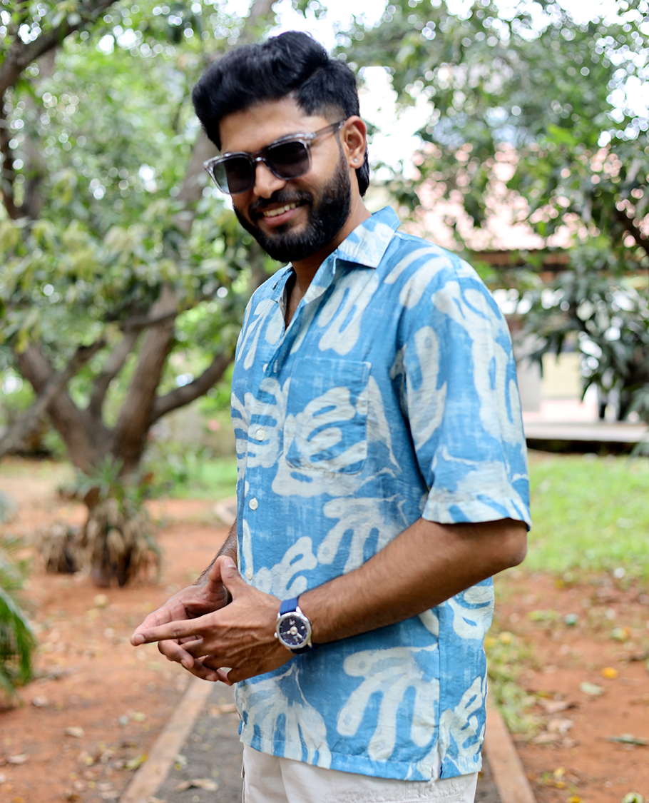 Blue Cotton-Blended Casual Shirt features an Abstract Print, Half Sleeves, Cuban Collar, Regular Fit, and Regular Length