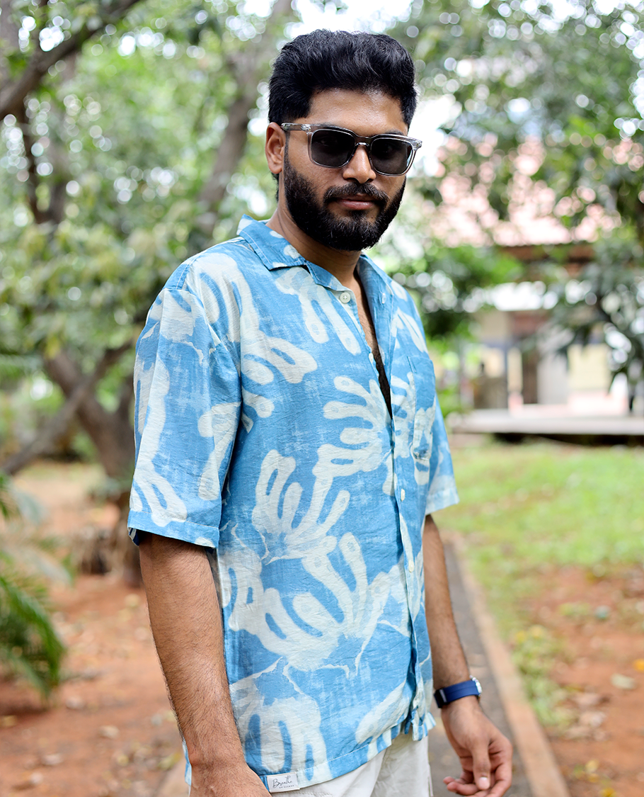 Blue Cotton-Blended Casual Shirt features an Abstract Print, Half Sleeves, Cuban Collar, Regular Fit, and Regular Length