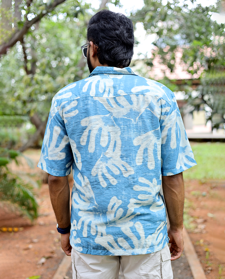 Blue Cotton-Blended Casual Shirt features an Abstract Print, Half Sleeves, Cuban Collar, Regular Fit, and Regular Length
