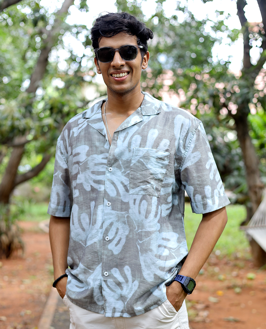 Brown Cotton-Blended Casual Shirt features an Abstract Print, Half Sleeves, Cuban Collar, Regular Fit, and Regular Length