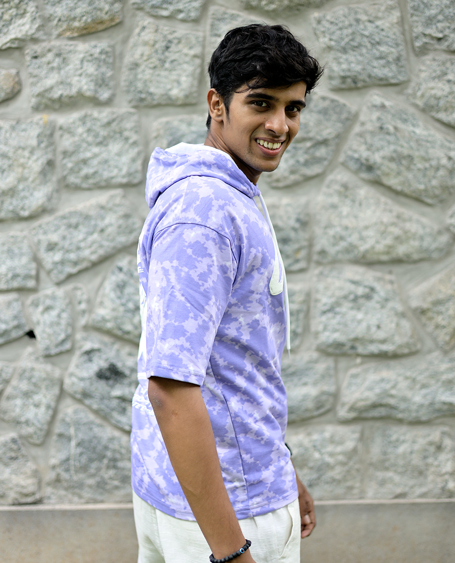 Lilac Cotton-Blended Oversized Hooded T-Shirt Features Abstract Dyed Typography Print, Half-Sleeves, and Regular Length