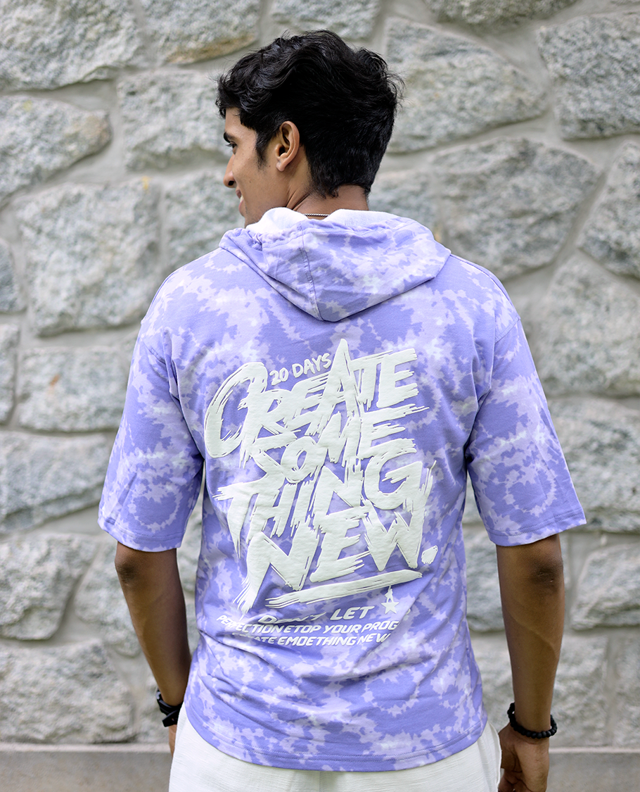 Lilac Cotton-Blended Oversized Hooded T-Shirt Features Abstract Dyed Typography Print, Half-Sleeves, and Regular Length