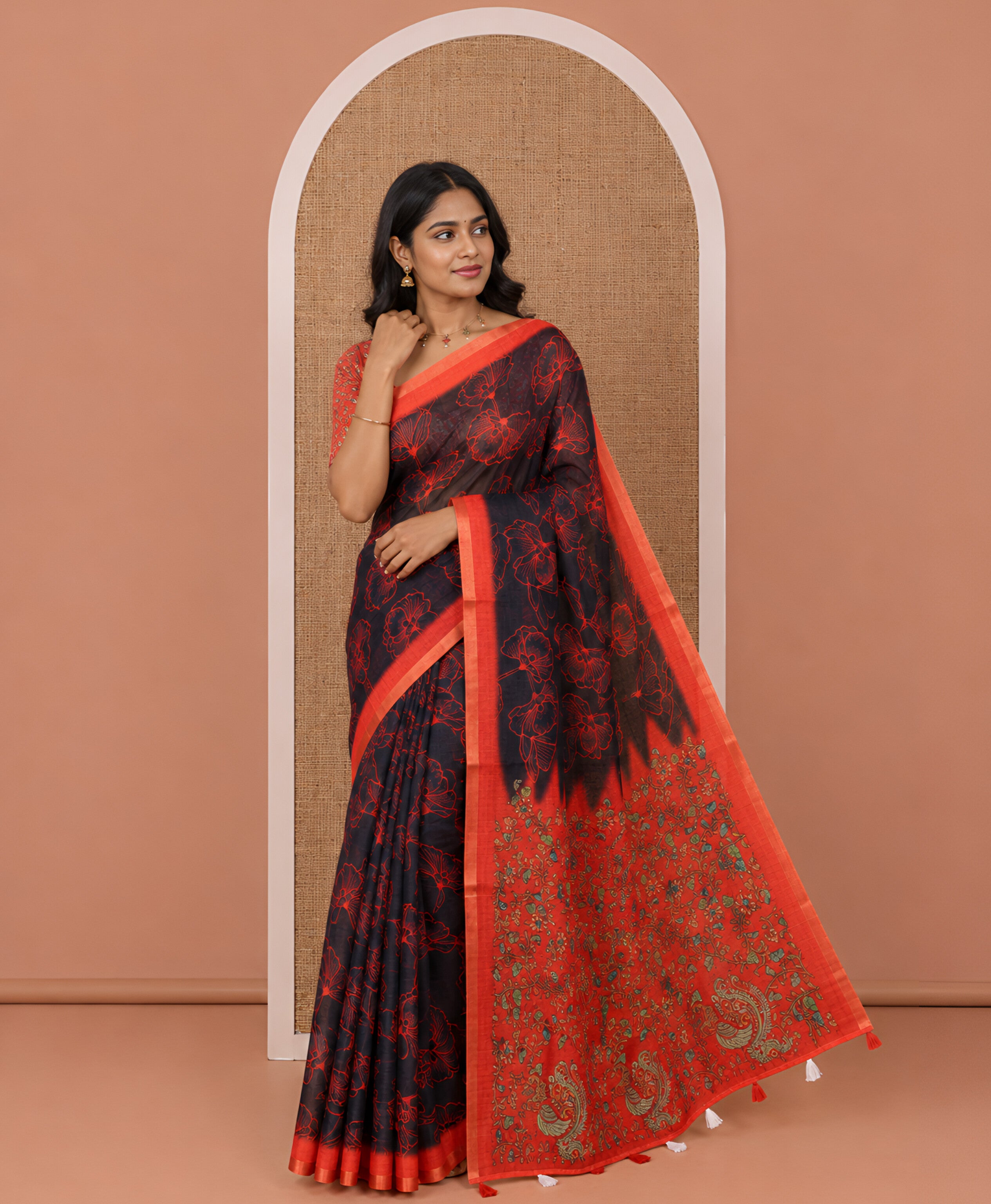 Black floral printed linen cotton saree, contrast piping border, kalamkari floral and peacock printed pallu, and a contrast floral vine printed blouse