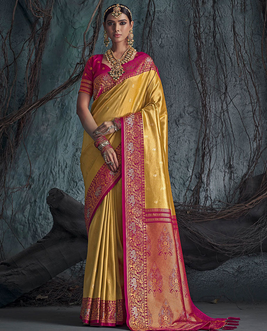 Gold Designer Saree, Subtly Sparkled with Buttas All Over Its Body, Complemented by a Contrast Floral and Elephant Border, Pallu of Intricate Designs, and Paired with a Contrast Blouse
