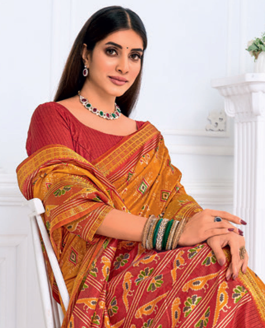 Orange Fancy Raw Silk Designer Catalog Saree, Prettified with Patola-Print, a Contrast Patola Border, Pallu of Patola Parrot Design, and a Contrast Blouse