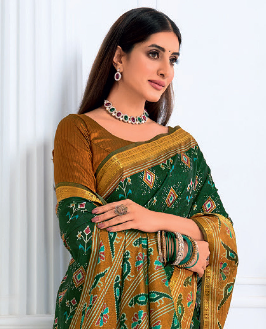 Dark Green Fancy Raw Silk Designer Catalog Saree, Prettified with Patola-Print, a Contrast Patola Border, Pallu of Patola Parrot Design, and a Contrast Blouse